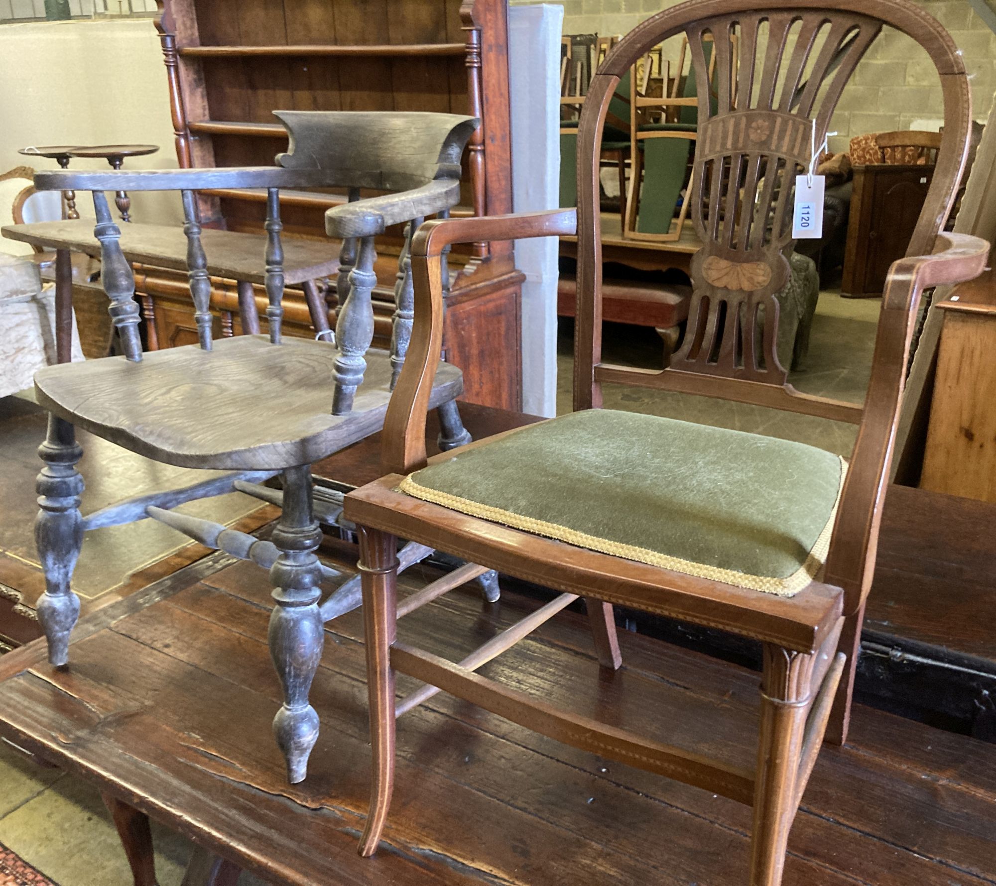 A Victorian bleached elm and ash smokers bow chair and an Edwardian inlaid mahogany elbow chair (2)